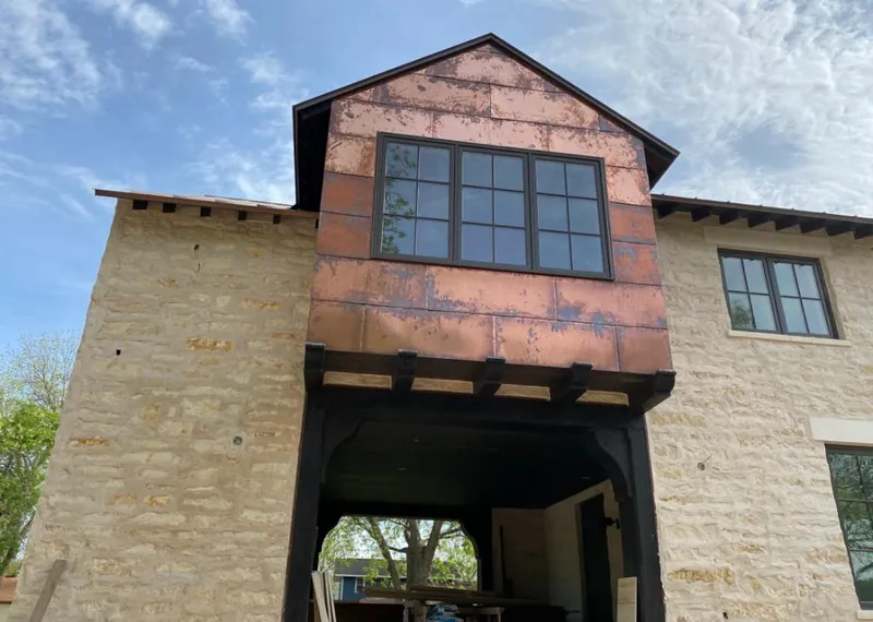 Copper metal panel facade on a stone building for Metal Roof Coating in Palmyra